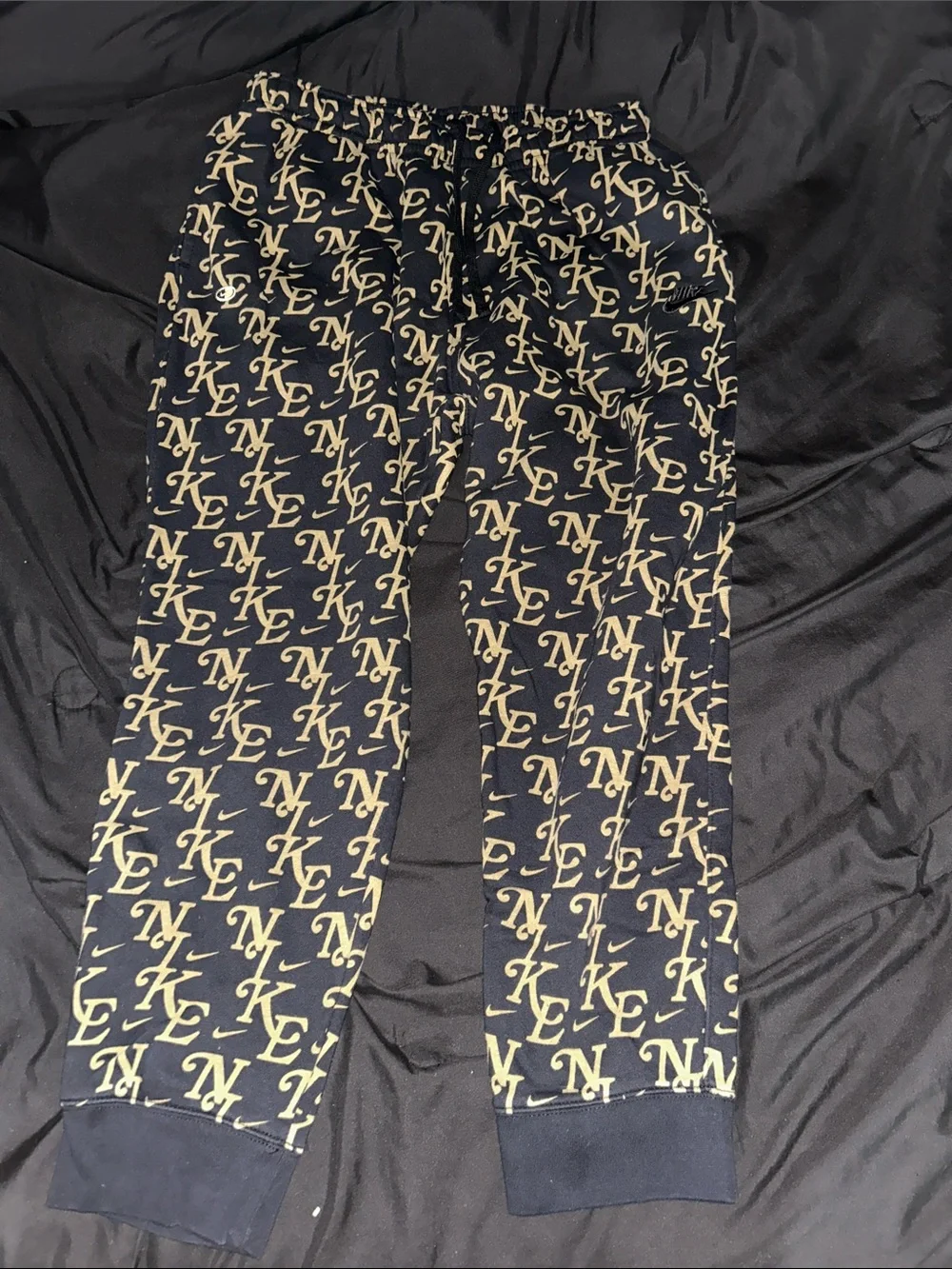 Nike Black & Gold Logo Allover Joggers - Picture 1 of 1